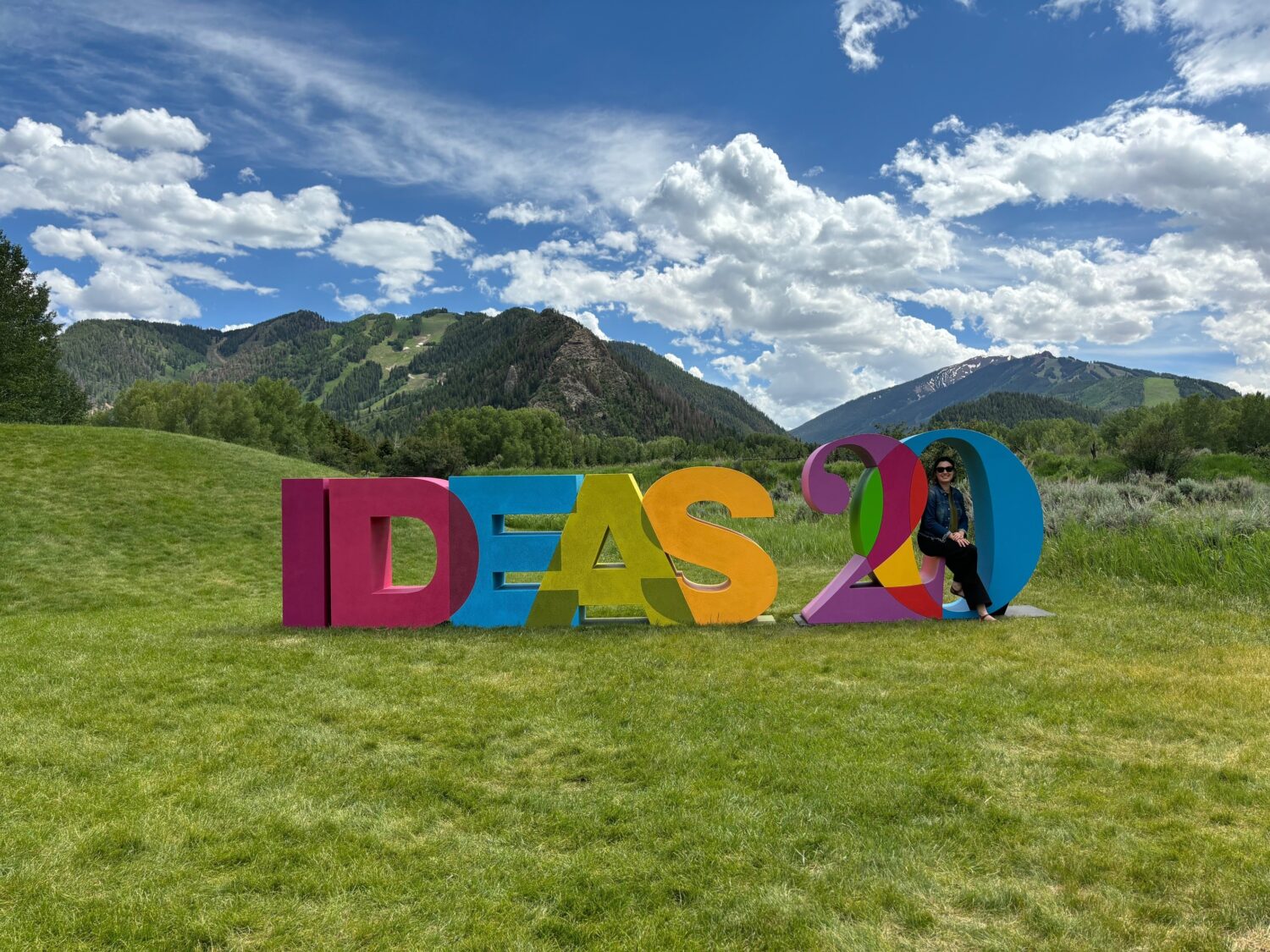 Genevieve Melford sits in the Ideas 20 letters on the Aspen campus.